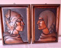 Front view of both carved plaques side by side