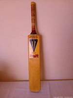 Front view of Duncan Fearnley Colt cricket bat standing upright