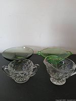 Group shot of four vintage glass pieces