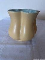 Front view of Rumrill #500 vase showing yellow exterior and ruffled form