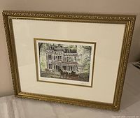 Front view of signed Walter Campbell print in ornate gold frame