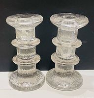Front view of both Pukeberg glass candleholders
