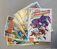 Fan arrangement of all seven bagged comics showing primary titles