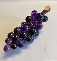 Entire purple acrylic grape cluster showing spheres and stem