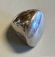 Angled view showing hammered surface and width