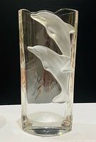 Front view showing two frosted dolphins on clear crystal vase