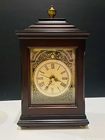 Front view showing entire clock, dial, and finish