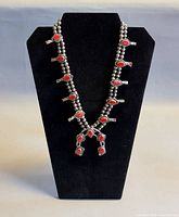 Necklace on display bust showing overall design and pendant