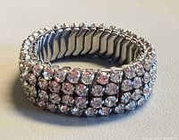 Oblique view of entire bracelet showing rhinestone rows and stretch design