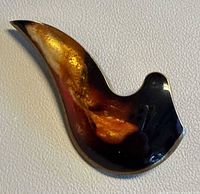 Front view showing marbled Bakelite colours and flame shape