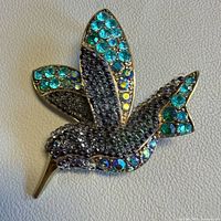 Front view showing blue and teal rhinestone hummingbird brooch
