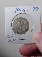 Front of holder showing reverse caribou design and date 1952