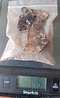 Bag of mica on scale showing 145 g
