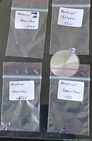 All four labelled bags with gemstones