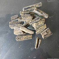 Group of epidote crystal fragments on surface