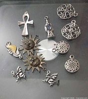 Group shot of all 11 pendants and charms