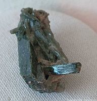 Oblique view showing pointed epidote crystal termination and matrix