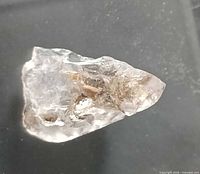 Full view of elestial quartz crystal on dark background