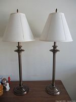 Both buffet lamps unlit on wooden surface