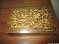 Top view showing marquetry inlay pattern and overall shape