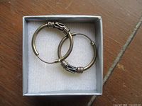 Earrings inside box on foam insert