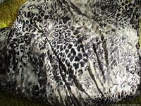 Full view of folded leopard print stretch fabric