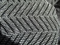 Close-up of black and white herringbone weave