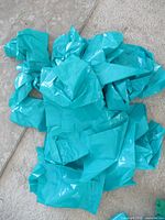 Pile of turquoise plastic bags
