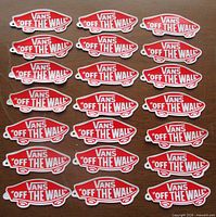 All 21 identical red/white Vans decals laid out in rows