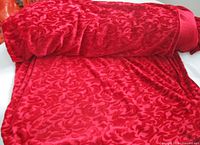 Full roll showing red velvet jacquard pattern