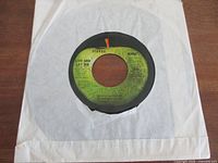 Front of record in sleeve showing A-side label Live And Let Die