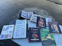 Overall view of binders, catalogs and books on table