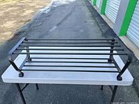 overall view of shoe rack showing two tiers and construction