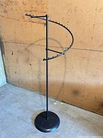 Full view of rack showing height, spiral arm, and base