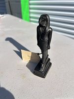 Front view showing full figurine and base