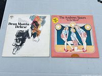 Front covers of Dean Martin Deluxe and The Andrews Sisters In the Mood
