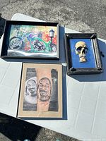 Group shot of all three framed wall art items on table