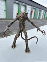 Full front view of alien action figure standing upright