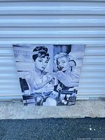 Full view of canvas print leaning against wall