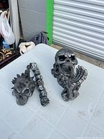 Full view of both skull ornaments on table