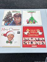 Front covers of all four Christmas LPs