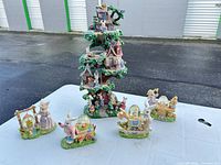 Group shot of all five resin bunny figurines on table