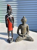 Front view of both figurines showing design and size contrast