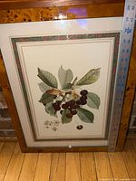 Front view showing cherry print, matting and frame