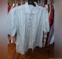 Full view of Johnnie-O short sleeve floral shirt on hanger