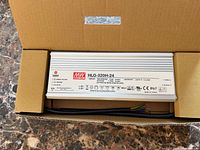 Driver in opened box showing label and wiring