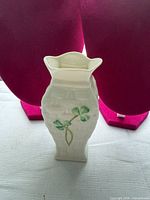 Front view of Belleek 4" basketweave porcelain vase with shamrock design