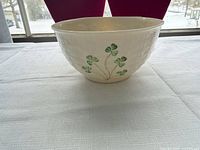 Front view of Belleek Shamrock cereal bowl on table