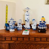 Front view of all five blue-and-white figurines on mantel