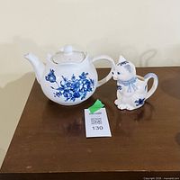 blue floral teapot and cat creamer on table